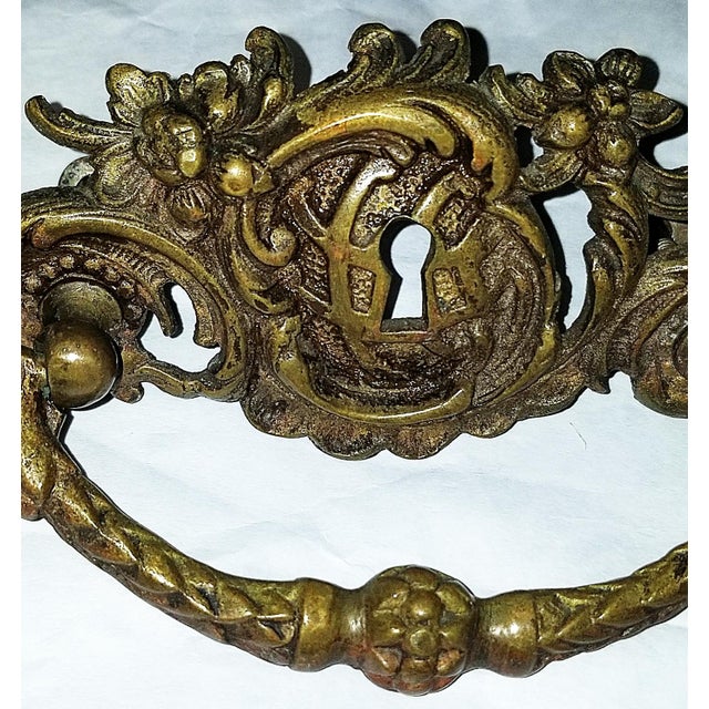 Make an impression with this 1920s French dore' bronze gold plated Louis XV rococo style door or drawer pull. One only....