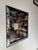 Striking original 1960s Hollywood Regency wall mirror featuring a bold black lacquered frame accented with distressed...