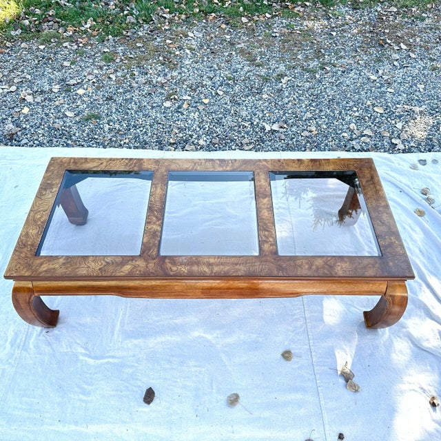 This elegant Asian Ming style coffee table from Taiwan features three beveled glass panel inlays (lightly smoked) and a...