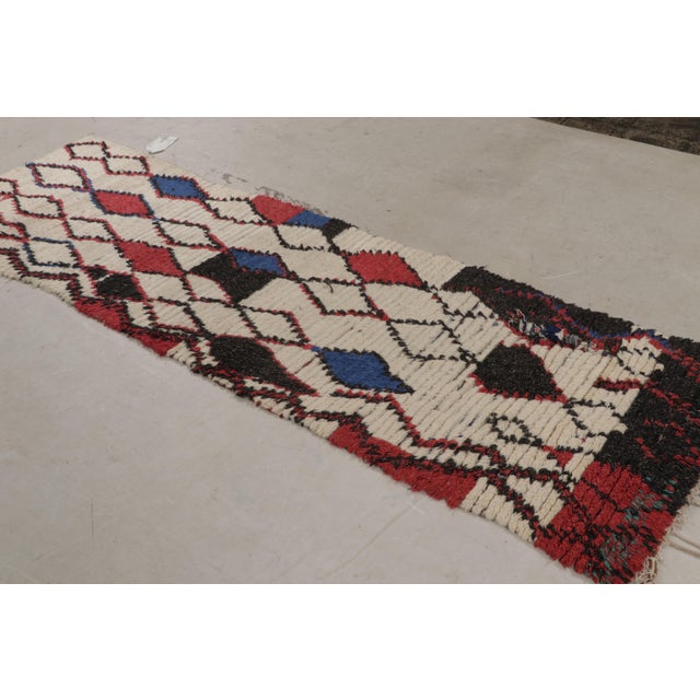 Originating From Morocco In 1950, This Vintage Midcentury Moroccan Wool Rug Features A Transitional Field Design With A...