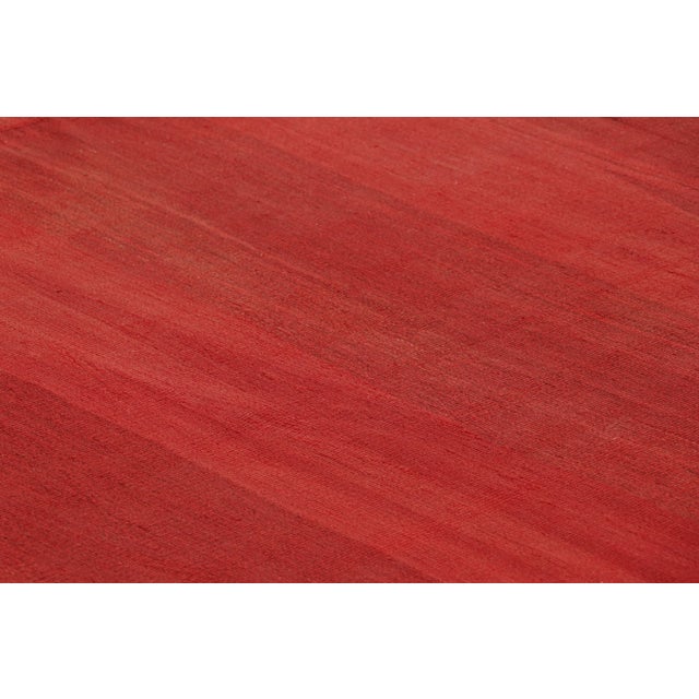 Handwoven in a wool flatweave, originating circa 1950-1960, this 9x10 vintage Turkish kilim is an excellent example of the...