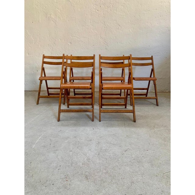 Set of six folding chairs 1960s Set of six folding chairs from the Palazzo degli esami in Rome. Measurements W45, D53, H60.