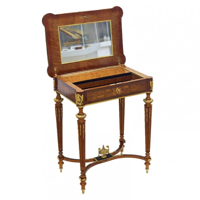 An elegant salon writing desk produced in France in the late 19th century, conceived in the Neoclassical tradition with a...