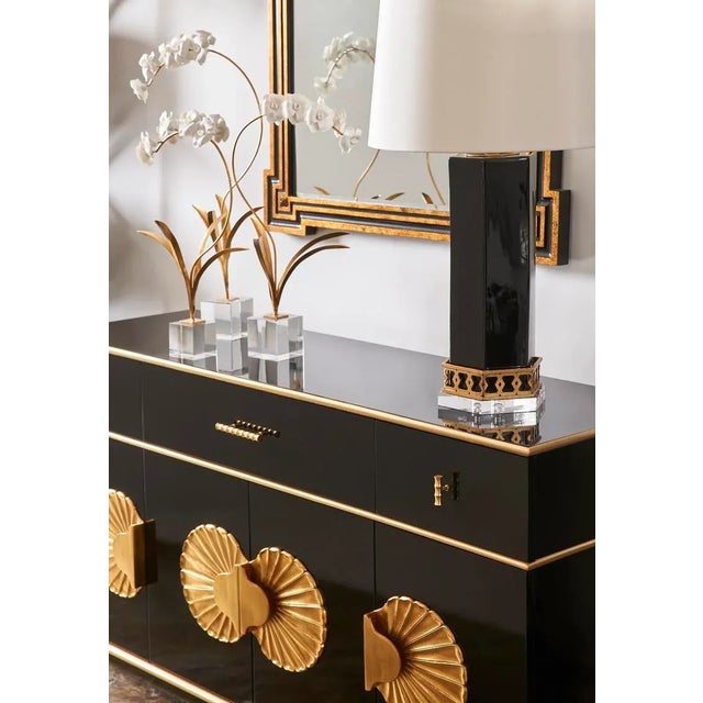 Make a grand statement at your next dinner party with the Palm Beach Buffet Cabinet. This piano black lacquer finished...