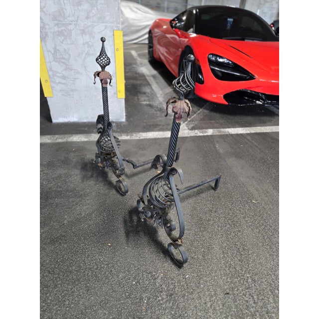 Large Mizner Style Turn of the Century Wrought Iron Andirons with some oxidation tometal but in oiverall very good vintage...