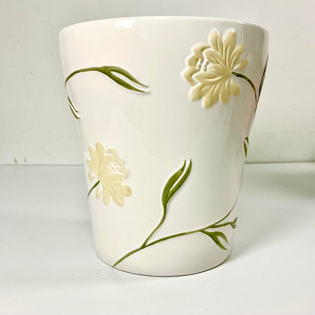 This is the lovely Penelope pattern from Croscill. It features an Art Nouveau style floral pattern with sage green stems...