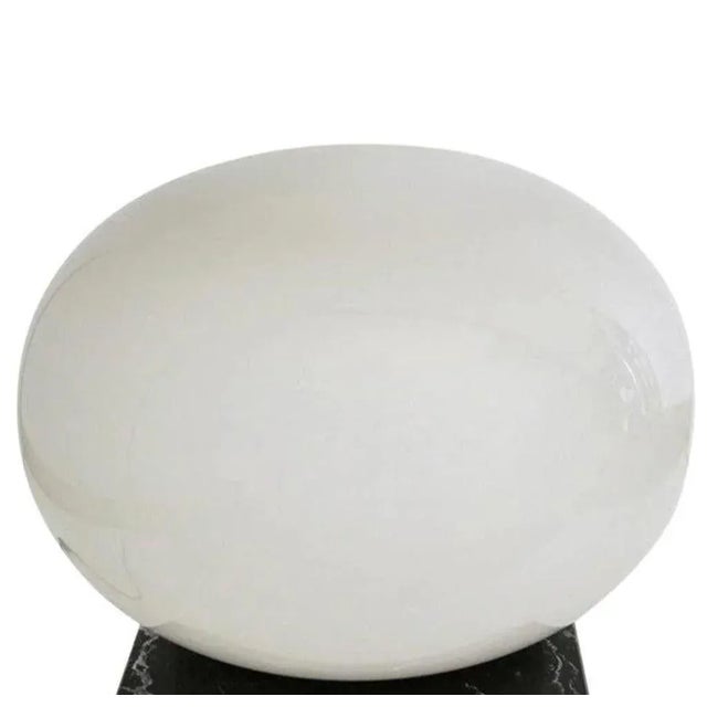 Oversized vintage Italian floor lamp with frosted glossy off-white Murano glass globe mounted on black marble base. Made...