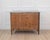 Dating to the eighteenth century and made in France, this Louis XVI chest of drawers is constructed in walnut and opens at...
