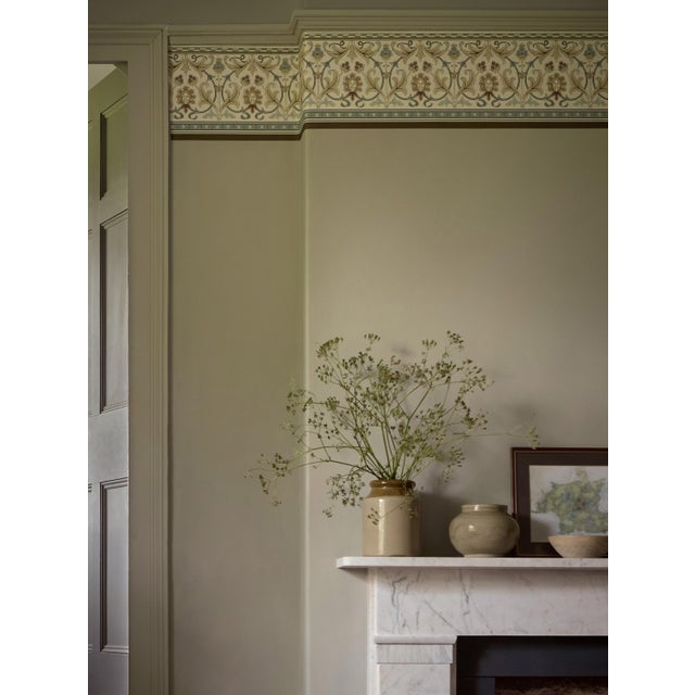 The original artwork suggests it was designed for a carpet border. Stylised floral and leaf formations are edged by...