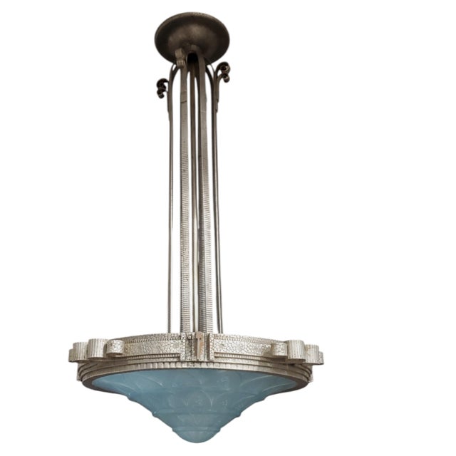 A striking French Art Deco chandelier attributed to Lorraine Nancy featuring a bold geometric design and exquisite...