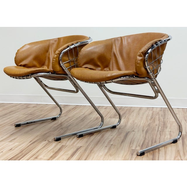 Vintage Mid Century Modern Flynn dining chair designed by Gastone Rinaldi and produced by Thema. Chromed metal mesh frame...