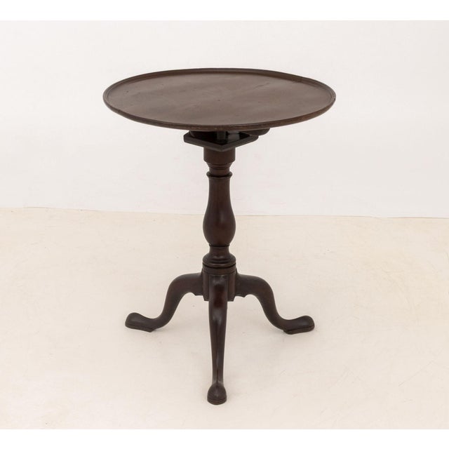 George III Style Mahogany Tripod Table, the birdcage tilt top above three cabriole legs. 28" H x 22.5" Diameter....