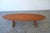This elegant surfboard-style coffee table was imported from Denmark by Moreddi in the 1950s. Meticulously crafted from...