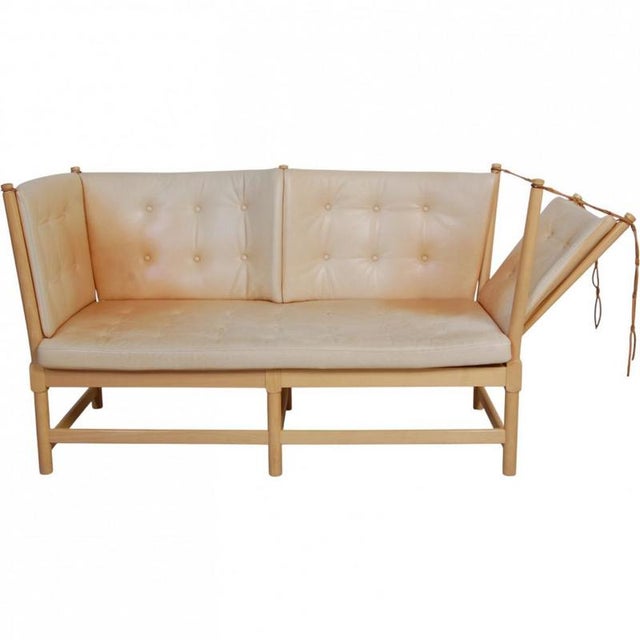 Børge Mogensen 2-seater Spoke-back sofa, model 1789, with a frame of lacquered beech and cushions of natural leather. The...