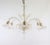 This handcrafted gold-infused cristallo Murano floral chandelier has six scroll arms with tri-lobed cups, with fin-like...