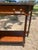 Elegant 19th-century French Louis XVI console table crafted in richly grained mahogany with refined neoclassical styling....