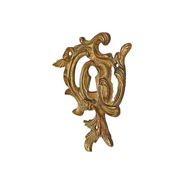 French bronze keyhole escutcheon in Rococo form to enhance as decor or a keyhole cover. Mounts with small nails or glue on...