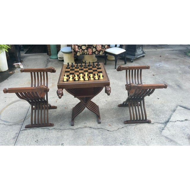 Up for consideration is a beautiful vintage wooden chess set, including chairs, a table base, chess table top, and chess...