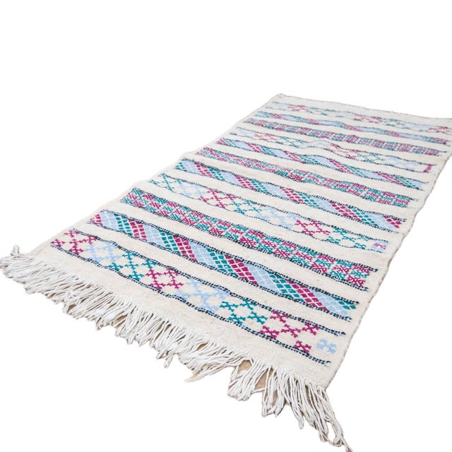 This is a genuine handmade Moroccan Kilim rug, created in the High Atlas mountains in Morocco, and it is distinguished by...