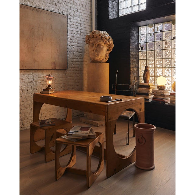 Born in Copenhagen’s experimental workshops of the early 1970s, this pine dining table and nesting‑stool ensemble reads...