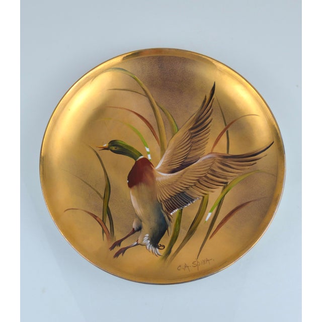 Good vintage condition. The landscape plate is in excellent condition. The duck plate shows a few small areas of paint...