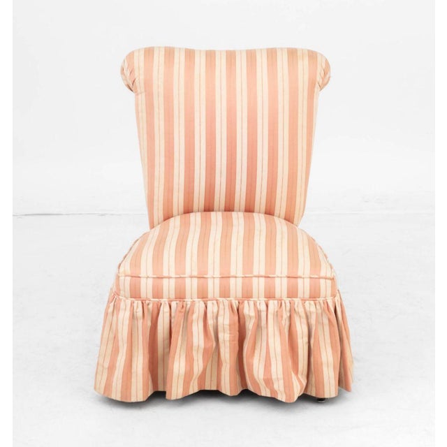 Pink and Beige Striped Silk Blend Upholstered Slipper Chair. 31" H x 22" W x 24" D; seat: 13" H. Provenance: From a...