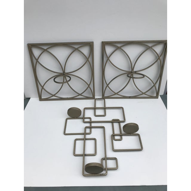 This is a delightful set of 3 mid century modern cast iron wall sconces. They could be arranged numerous ways to fit into...