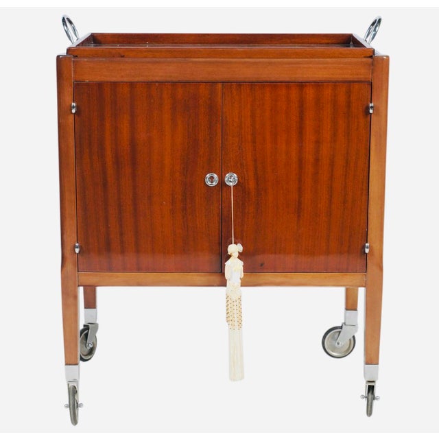 Elegant and highly functional Art Deco drinks trolley by the celebrated Paris luxury retailer Kirby Beard & Co. Crafted in...