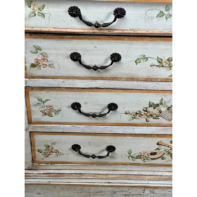 This beautiful antique Italian commode dates to the early 19th century and features a wonderfully decorative painted...