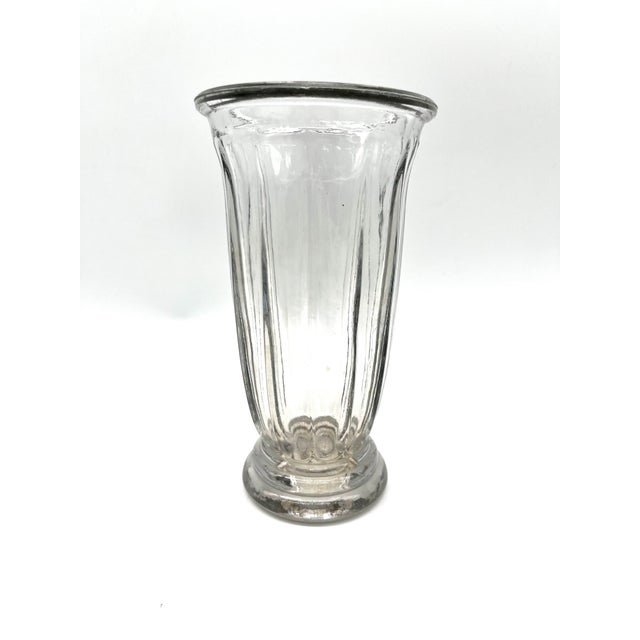 A striking and exceptionally heavy Art Deco pressed glass vase (740 grams) from the 1930s. This piece captivates with its...