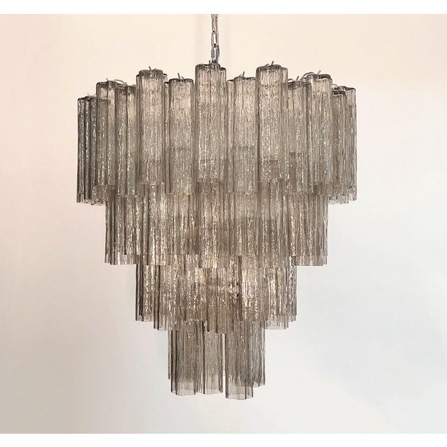 An extraordinary Italian chandelier handcrafted, featuring a striking four-level architectural composition. This...