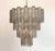 An extraordinary Italian chandelier handcrafted, featuring a striking four-level architectural composition. This...