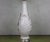 This elegant American 1940s white ceramic lamp embodies timeless sophistication. It features graceful stylized leaves,...