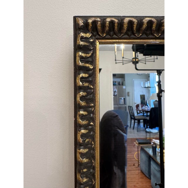 This pair of vintage wood frames each feature a deep, repeating U-shaped carved pattern (scalloping) that creates a heavy,...