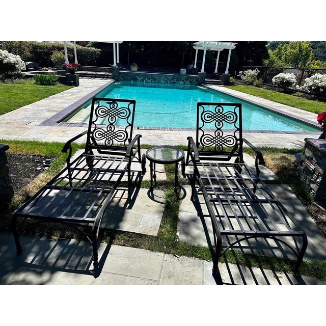 2 Chaise lounge chairs by Cast Classics as pictured . Monte cristo collection cigar emblem Landgrave Collection On wheels...