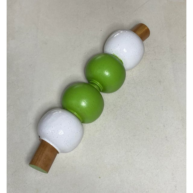 Artistic object in white glazed ceramic and green painted with cherry wood turned elements. Copper plate Meccani. Design...