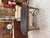 This antique oak console table has been fully restored. It features a black-patinated top, a trim, and a base made of...