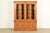 An exceptional Italian Neoclassical or Mediterranean style lighted breakfront bookcase cabinet or dining cabinet By...