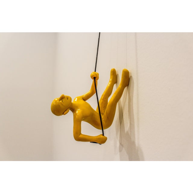Our Vibrant Yellow Climbing Man is a beautiful addition to your wall decor! Curate your own collection with our variety of...