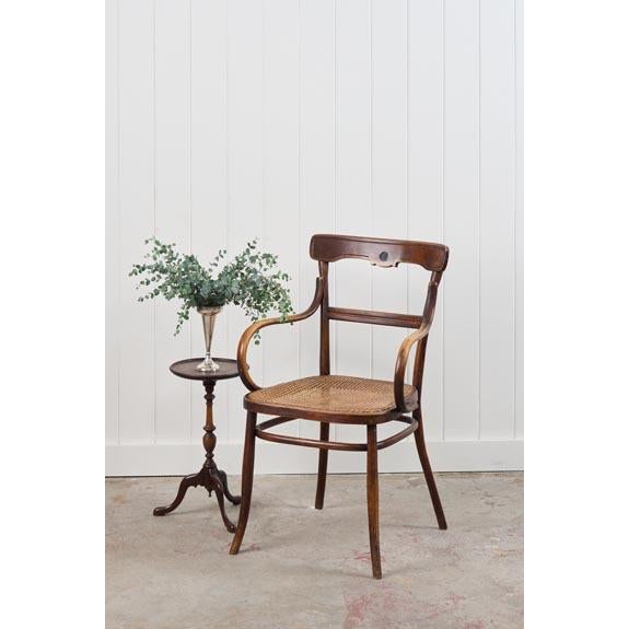Edwardian bentwood occasional chair with a hand-tied cane seat, curved bentwood frame, and lightweight silhouette.