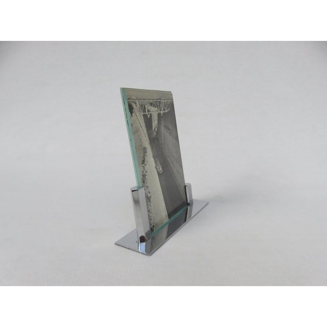 An elegant picture frame, crafted in the typically austere style of the French Art Deco period. The frame is handmade. The...