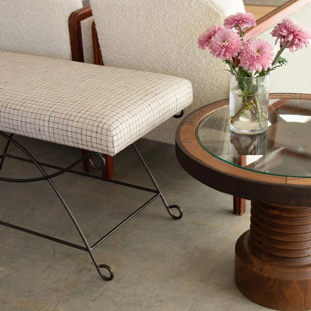 Beautiful iron bench with curved and looped base painted in a matte black finish inspired by French design. Rectangular...