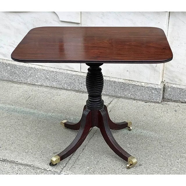 Extra Fine late 18th - Early 19th c. Federal tilt-top Tea table in Flamboyant Mahogany with reeded one board top supported...