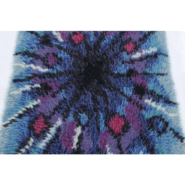 Hand-knotted in lush, high-pile wool in Sweden circa 1960-1970, this 2x4 vintage Swedish Rya rug is a bold new addition to...