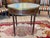 A late 19th C French Bouillotte table with white marble top set inside a pierced brass gallery. The frieze holds drawers...