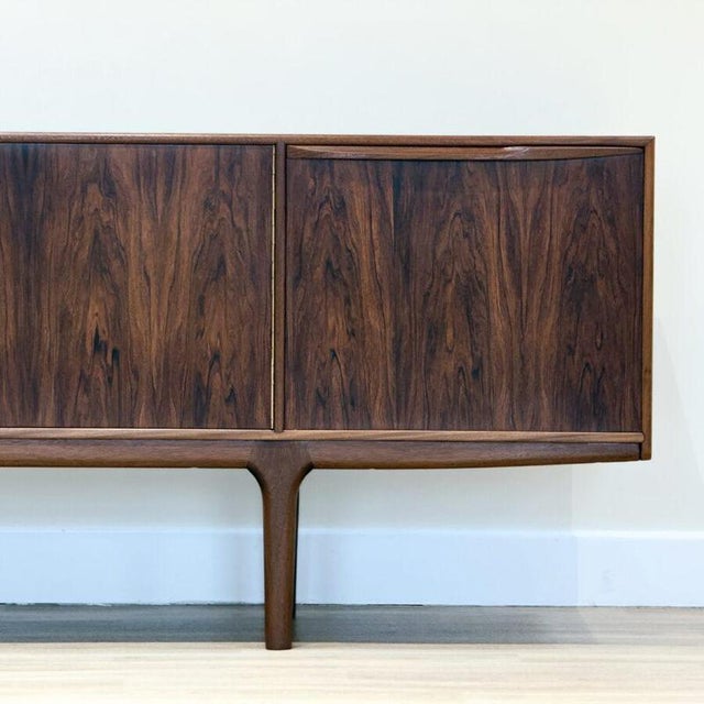 Designed by tom robertson for a.h. Mcintosh’s prestigious dunfermline collection in scotland, this exquisite sideboard...