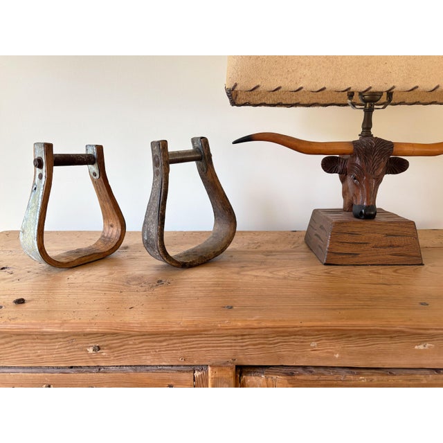 Add texture and character to your southwest or eclectic décor with this mismatched pair of vintage western horse saddle...