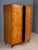 A striking vintage mid-century wardrobe cabinet from Czechoslovakia, featuring a tall rectangular form, two large front...