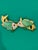 1980's kissing fish brooch by jewelry designer Kenneth Jay Lane. These cheeky gold-tone fish have green lucite bodies...