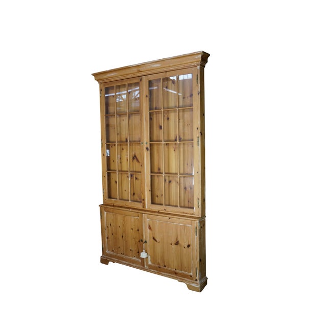 This exceptionally narrow English display cabinet features a highly diminutive footprint that makes it a rare and unique...